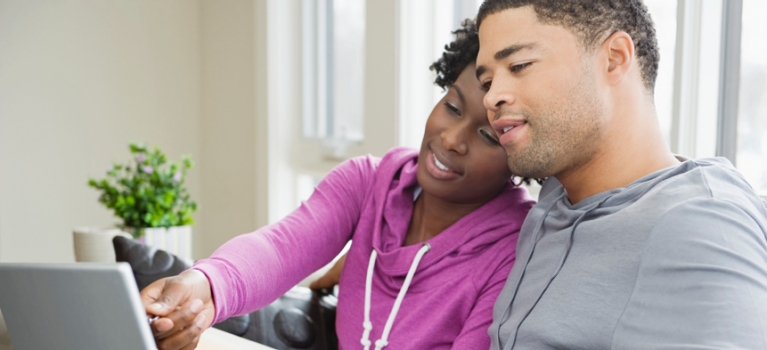 Young couple using laptop